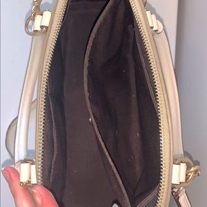 Tan and white Coach purse and wallet